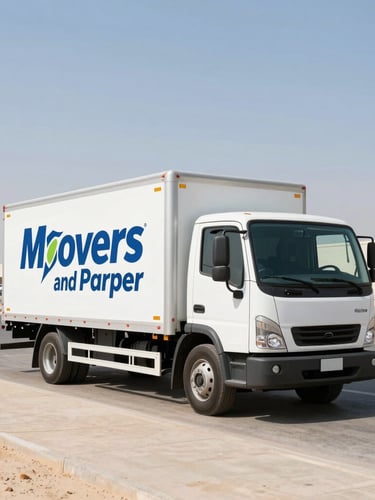 Straight-on wide-angle shot of a clean, branded Movers and Packers Cargo truck parked in Dubai Production City, bright midday desert sunlight, sharp focus