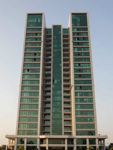 Symmetrical wide-angle architectural exterior of a modern luxury high-rise in Gurgaon under crisp morning light, deep forest green accents, high-end editorial style