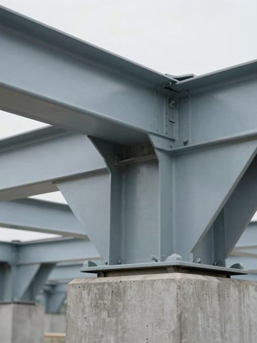 Sharp close-up of structural steel joists and concrete foundation under overcast daylight, desaturated cool tones, professional depth of field