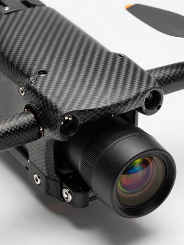 Extreme close-up of a carbon fiber drone chassis and calibrated LiDAR sensor payload, crisp studio lighting highlighting technical mechanics and lens reflections.