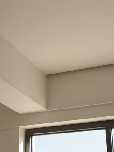 Close-up of a premium matte-finish PVC ceiling joint with clean architectural alignment, bright natural daylight, warm neutral tones, sharp focus