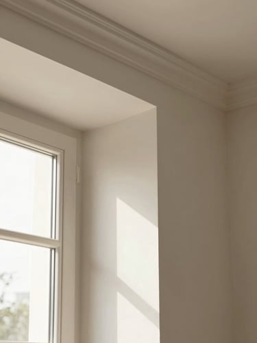 Close-up of elegant wall moulding with clean joints under soft natural window light, architectural focus