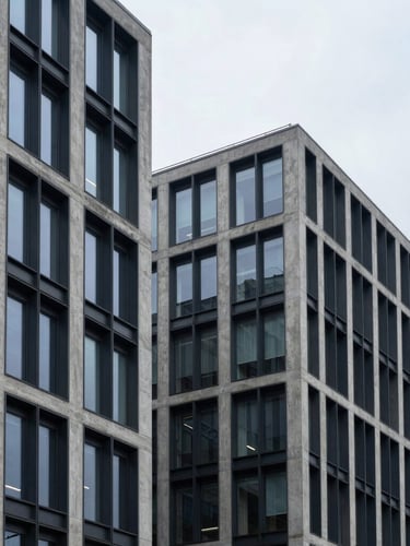 Architectural crop of a modern corporate office building with concrete and dark steel lines, cool overcast daylight, sharp focus, 35mm