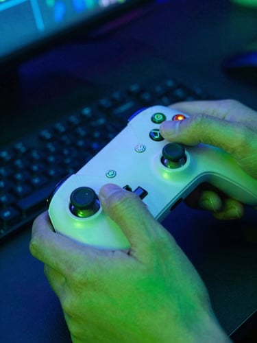 Close-up of hands on a gaming controller under intense electric blue and acid green neon lighting, high-contrast, vibrant cyber tones, shallow depth of field