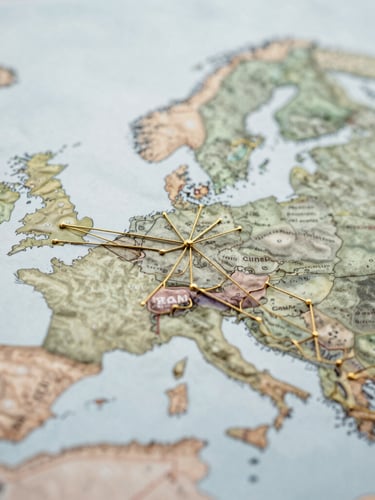 Macro close-up of structured abstract trade maps showing thin gold lines connecting European cities, diffused overcast daylight, clean editorial composition.