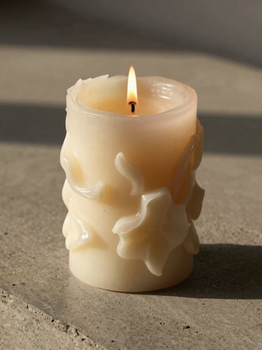 A close-up portrait of an intricate sculptural candle bouquet burning cleanly on a raw concrete slab, soft afternoon shadows stretching to the side, warm golden hour tones.