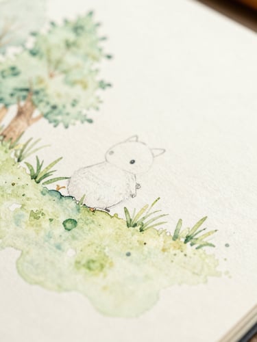 A close-up macro photograph of a watercolor study, showing delicate green sage washes and soft pencil sketches of a small forest character, warm daylight