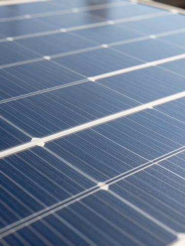 Crisp macro photograph of a silicon solar cell under bright natural daylight, highlighting precise technical grid lines and clean structural textures.
