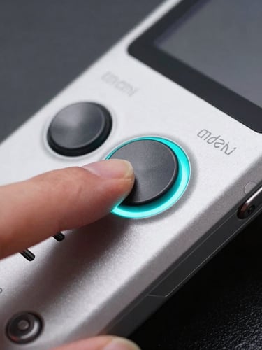 Extreme close-up of a finger pressing a physical mechanical button on a custom Android handheld console, sharp cyan rim light on matte metal