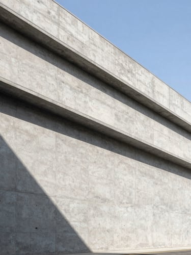 Wide-angle architectural crop of a modern concrete industrial park facade under sharp daylight shadows, high-contrast, clean geometric lines