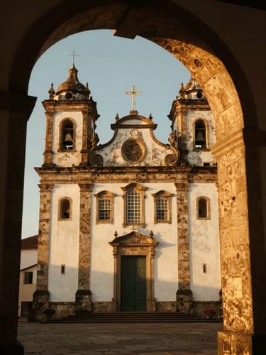 Warm golden hour view of the historic Jesuit church in Anchieta, stone arches, soft sunlight, cinematic 35mm photography