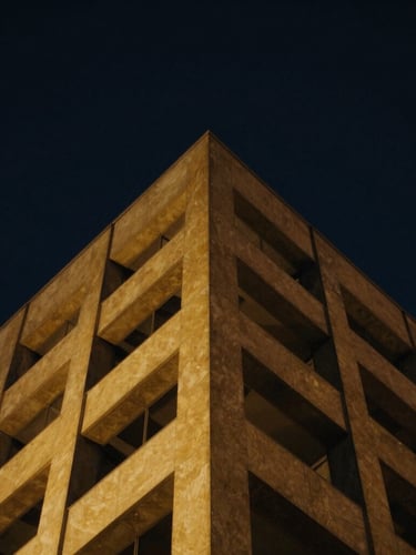 Low-key high-contrast architectural photograph of a golden geometric structure rising into a deep midnight navy sky, 35mm cinematic lighting