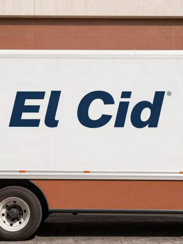 Side profile of a clean, modern refrigerated delivery truck with El Cid branding parked in bright California daylight, sharp focus