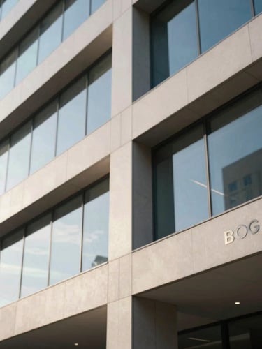 Architectural detail of a modern law office in Bogotá, clean lines, glass walls reflecting soft natural window light, professional atmosphere, 35mm