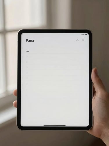 A hand holding a clean tablet displaying a minimalist planner page, soft morning window light, warm shadows