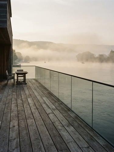 Soft morning light over the Danube river, mist rising from the water, architectural wooden deck of Donauhaus in the foreground, 35mm warm editorial photography