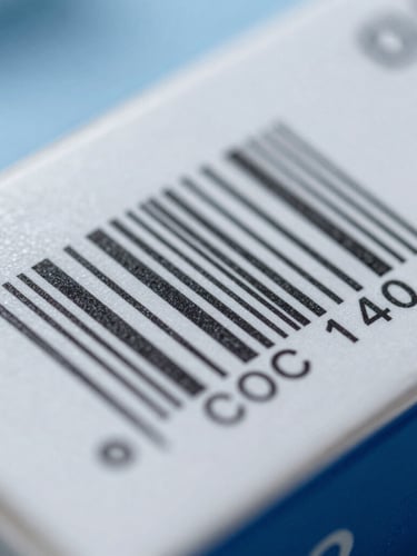 Macro close-up of a sealed pharmaceutical box with a high-contrast batch tracking barcode, sterile white and blue packaging, sharp focus under cool clinical lighting.