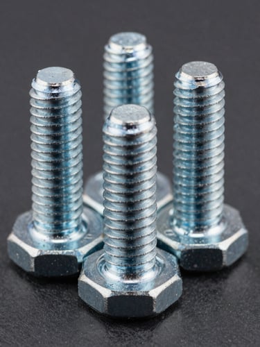 Macro shot of clean, precision-machined steel threads on heavy foundation bolts, sharp metallic highlights, deep slate background, high-contrast studio lighting