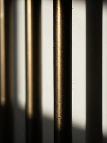 Macro close-up of a high-end physical asset, sharp directional window light, deep shadows with gold accents, cinematic 35mm