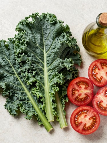 Overhead flat-lay of raw, vibrant ingredients: dark leafy kale, sliced heirloom tomatoes, and cold-pressed olive oil on a clean stone surface under bright daylight.