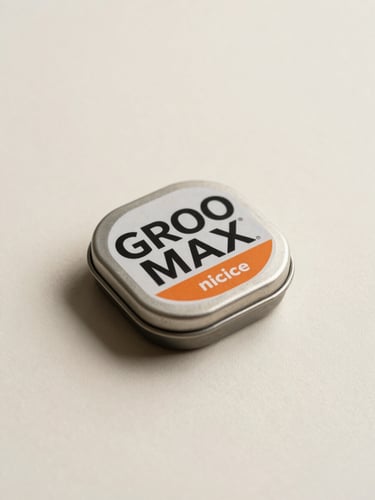GROO MAX nicotine pouch tin, studio flat-lay on a clean cream surface, soft diffuse fill light with a subtle rim highlight on the product edge, shot from a slight 45-degree angle, generous negative space to the right