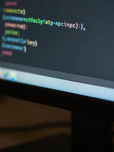 Macro close-up of clean code on a high-resolution monitor in a dark room, sharp teal light reflecting on the screen edge