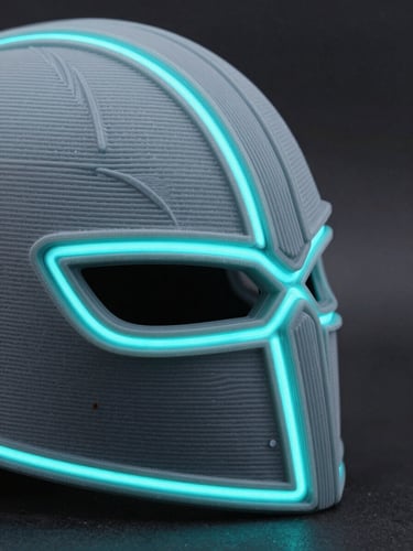 Extreme close-up of a 3D printed cosplay helmet seam with glowing cyan neon rim light on a dark slate background, sharp macro details of the layer lines, high-contrast product photography, 35mm lens