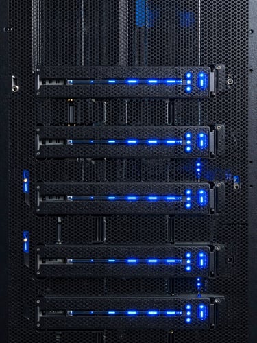 Straight-on architectural macro shot of a pristine server rack, cool-toned dark charcoal chassis with sharp electric blue LED status indicators, clean vertical lines.