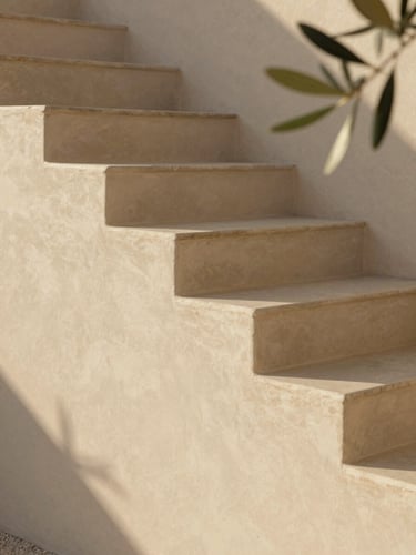 Close-up of three stone steps of a minimalist Mediterranean staircase in warm afternoon sunlight, clean lines, serene atmosphere, editorial photography