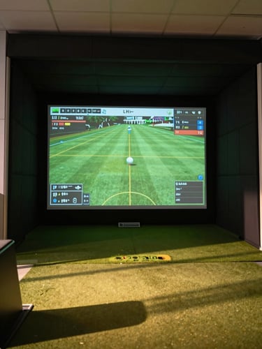 A sleek indoor golf simulator bay in Orange Park, high-tech launch monitor displaying ball flight data on a large screen, crisp lighting