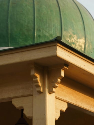 Close-up of wooden architectural details of an Indonesian mosque, warm golden hour light, soft focus, rich textures