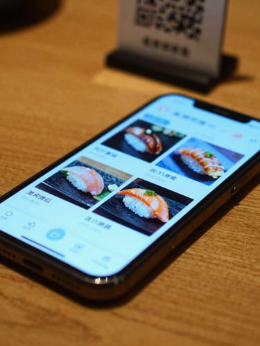 Close-up of a smartphone screen displaying a vibrant sushi menu with a glowing cyan interface, resting on a warm wooden restaurant table with a subtle QR code stand, soft ambient background lighting, shallow depth of field, 35mm
