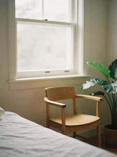 Soft natural light filtering through a window into a calm therapy room, a wooden chair, a green plant, warm editorial 35mm photography