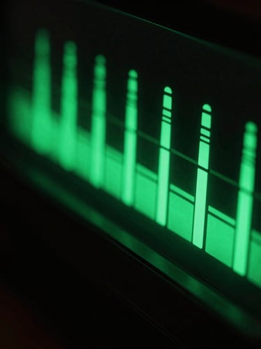 Macro shot of green LED audio level meters glowing in a dark music studio, sharp shadows, high-contrast cyber-brutalist aesthetic