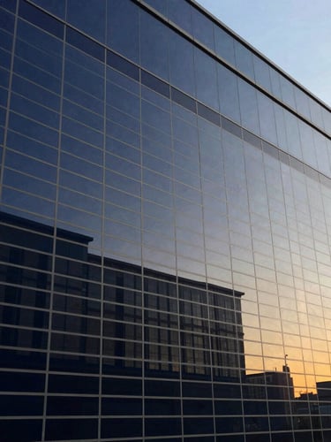 Close-up of a commercial financial spreadsheet on a screen, clean architectural glass reflection, sharp focus, deep navy tones