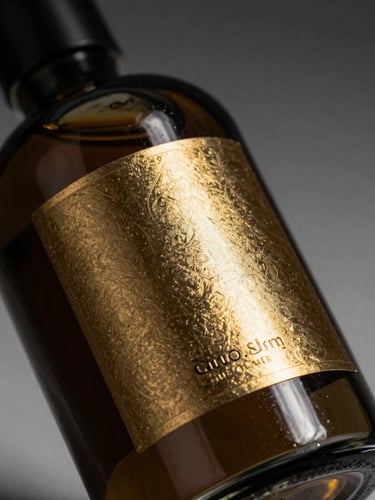 Premium studio product photography, elegant glass bottle with gold embossed label, dramatic side-lighting, deep shadows