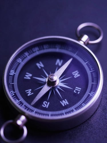 A macro close-up of an intricate metallic silver compass reflecting deep indigo and amethyst light, atmospheric studio setting, soft celestial glow