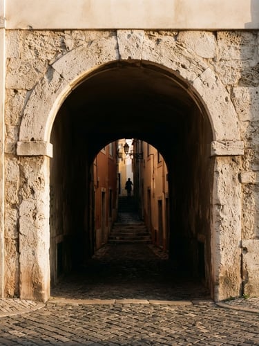 Editorial architectural photography of a minimalist limestone arch in Lisbon, soft golden-hour light, deep shadows, 35mm film