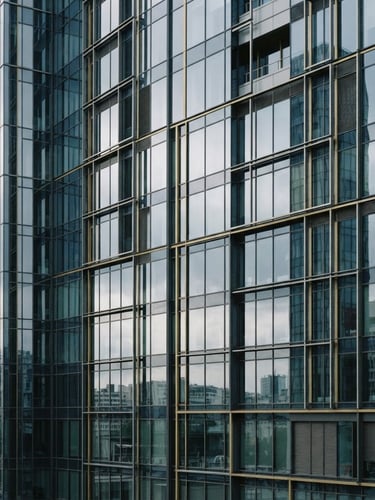 Architectural detail of a modern European business district, clean glass facade reflecting soft overcast daylight, corporate navy tones, 35mm photography