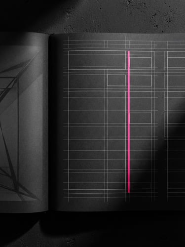 Close-up studio flat-lay of a technical brand guidelines book, open on a typography grid page, sharp high-contrast shadows, dark-mode styling with a single vibrant pink accent line.