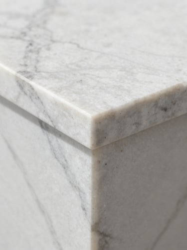 Macro shot of a book-matched marble countertop seam, bright natural daylight, invisible joint, crisp polished stone texture