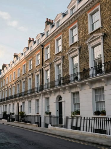 Wide-angle architectural view of a refined London residential street, elegant brick facades under soft morning daylight, quiet streetscape.