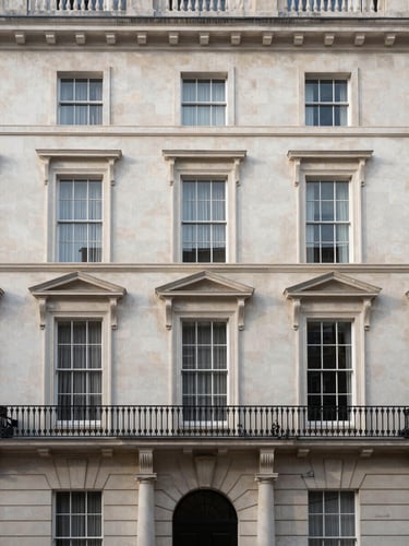 Architectural portrait crop of a classic London townhouse facade in Kensington, soft morning daylight, straight-on framing, clean stone details.