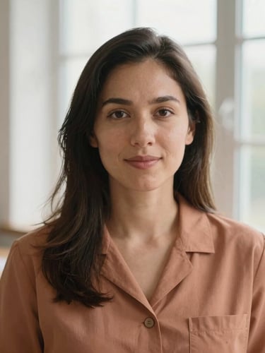 Warm environmental portrait of a professional female psychologist, natural window light, soft terracotta tones, shallow depth of field, 35mm
