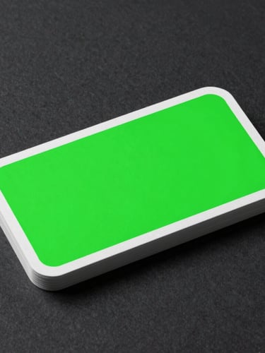 A minimalist technical diagram of a business card showing a 3mm bleed line in neon green, a solid white trim line, and a safe text zone, sharp studio lighting, 3D paper mockup on dark charcoal surface