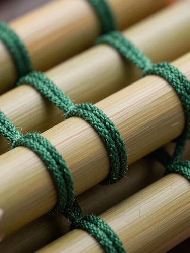 Close-up macro shot of seasoned split bamboo stalks, meticulously hand-woven with heavy-duty forest green cotton cords, showing the rich organic texture and precise alignment