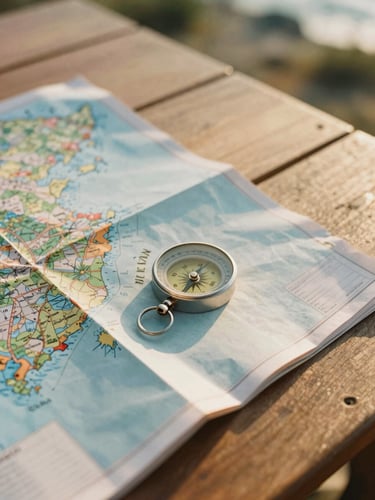 Intimate medium shot of a physical travel map and a compass resting on a sun-drenched wooden table, warm golden-hour light, shallow depth of field, 35mm film