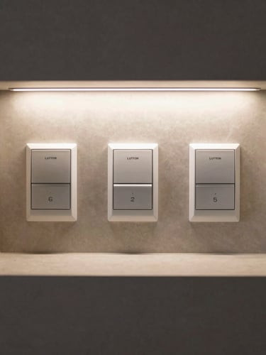 Straight-on architectural shot of a luxury custom home interior with flush-mounted Lutron keypads and clean mud-in LED channels, warm directional lighting