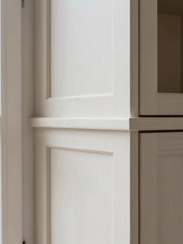 Detail shot of clean craftsman-level trim and tight joinery on a custom timber-frame built-in cabinet, soft side-lighting from a nearby window.