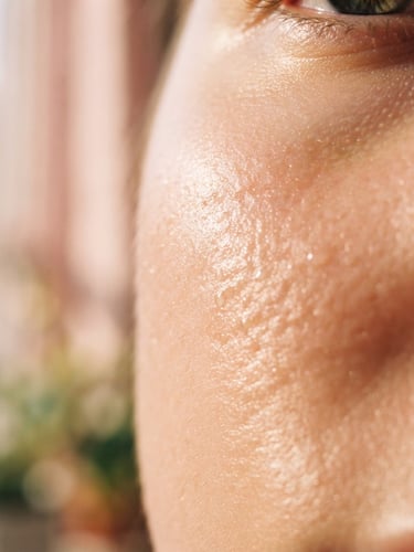 Macro close-up of natural dewy skin texture with soft morning sunlight, shallow depth of field, 35mm